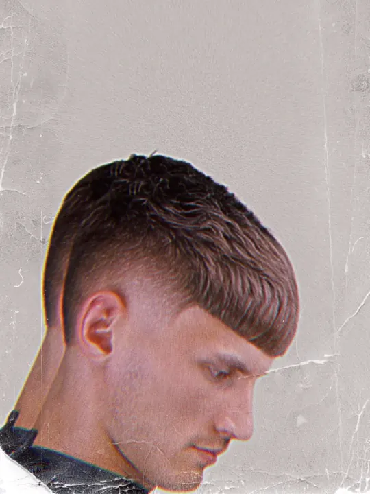 Short crop with a fringe and a fade